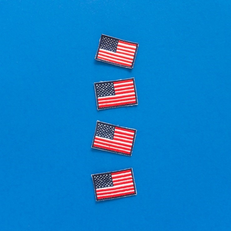 Close-up of an American flag patch on a uniform sleeve, showing correct placement orientation.









