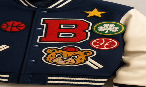 Varsity jacket with chenille patches: bear, letter B, basketballs, star, and a green clover.